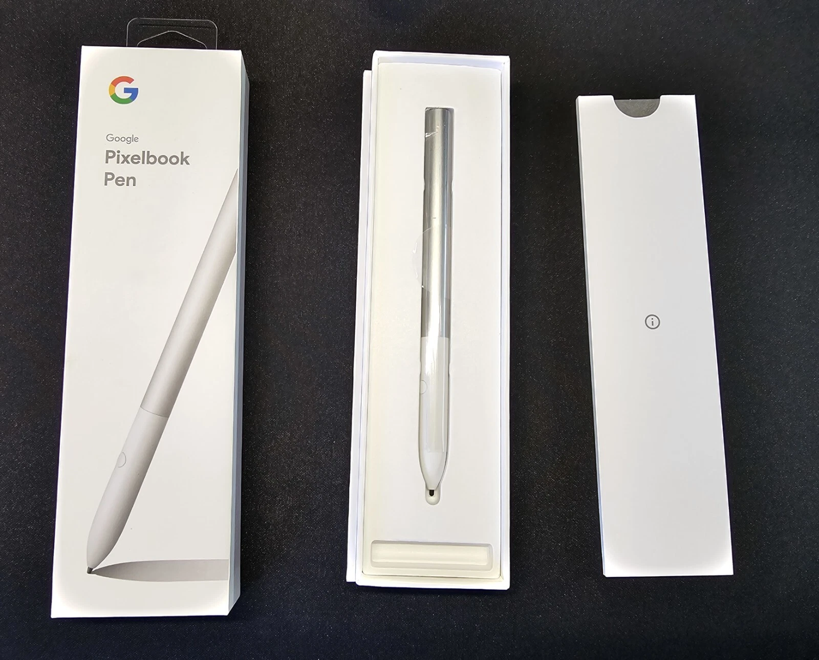 Google Pixelbook Pen in its original packaging, a light gray stylus with white cardboard boxes.