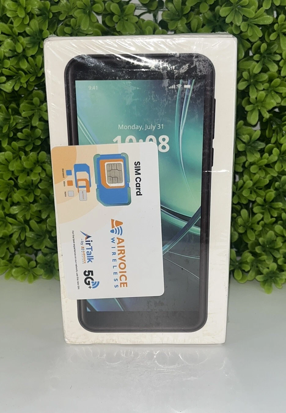 New, unopened smartphone box with a dark gray phone, SIM card, and Airvoice Wireless 5G+ branding.
