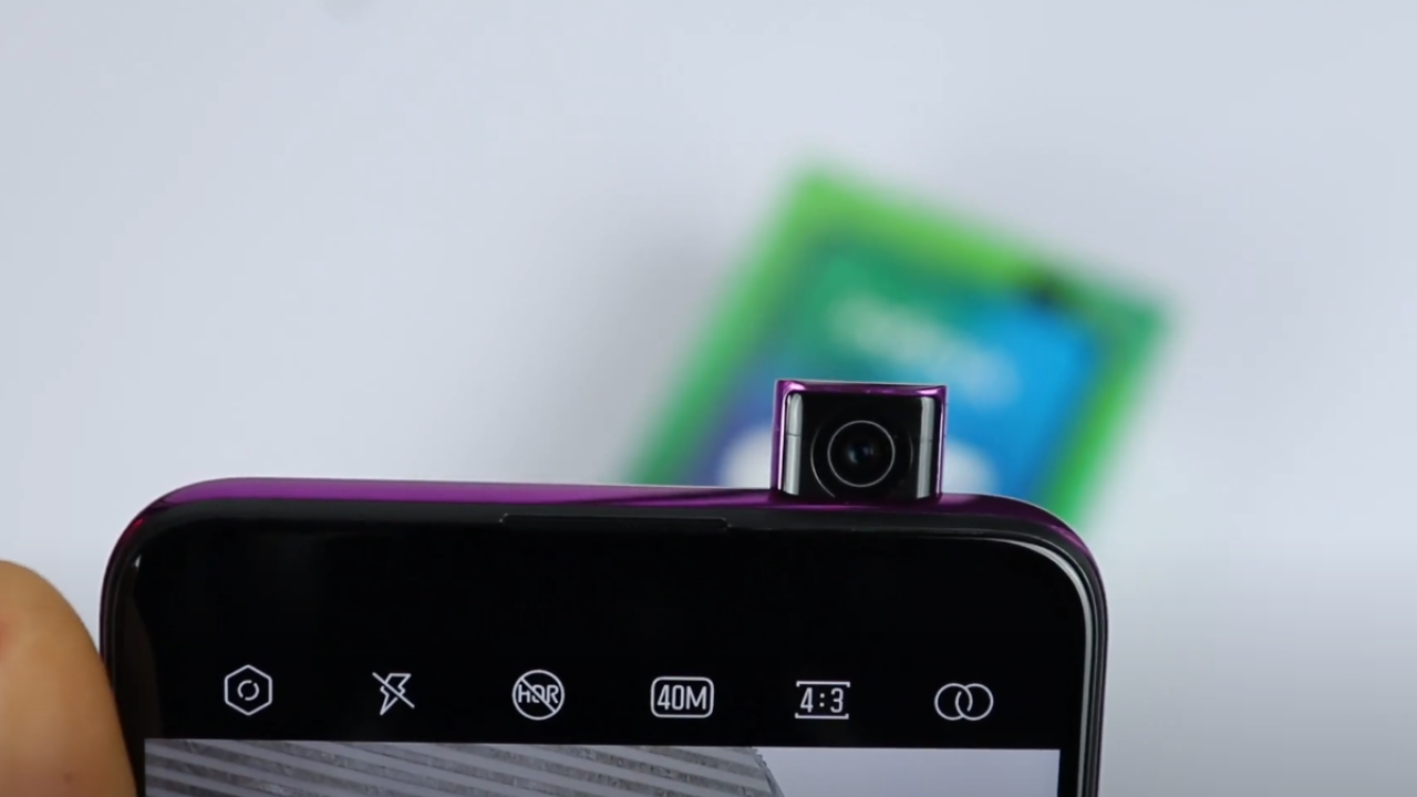 Infinix S5 Pro pop-up selfie camera emerging from the top of the phone.