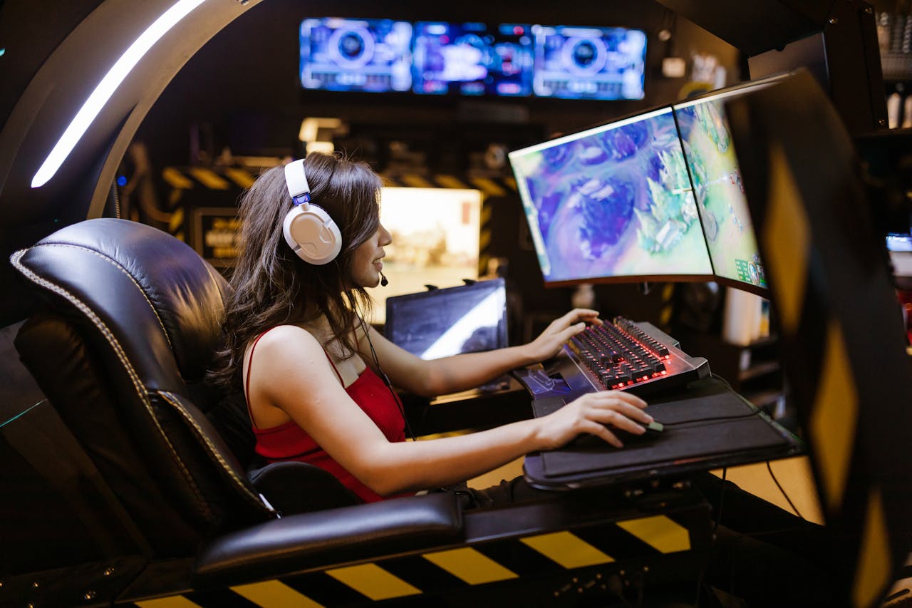 A curved monitor with a gamer sitting in front, highlighting the immersive gaming experience.