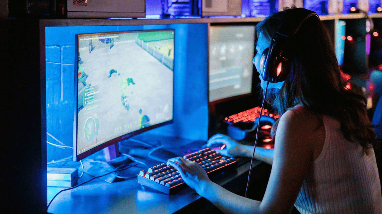  Gamer wearing headphones playing a fast-paced game on a TN display